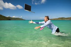 business-man-diving-for-laptop-in-ocean-data-security-ciphertex-data-security-usa